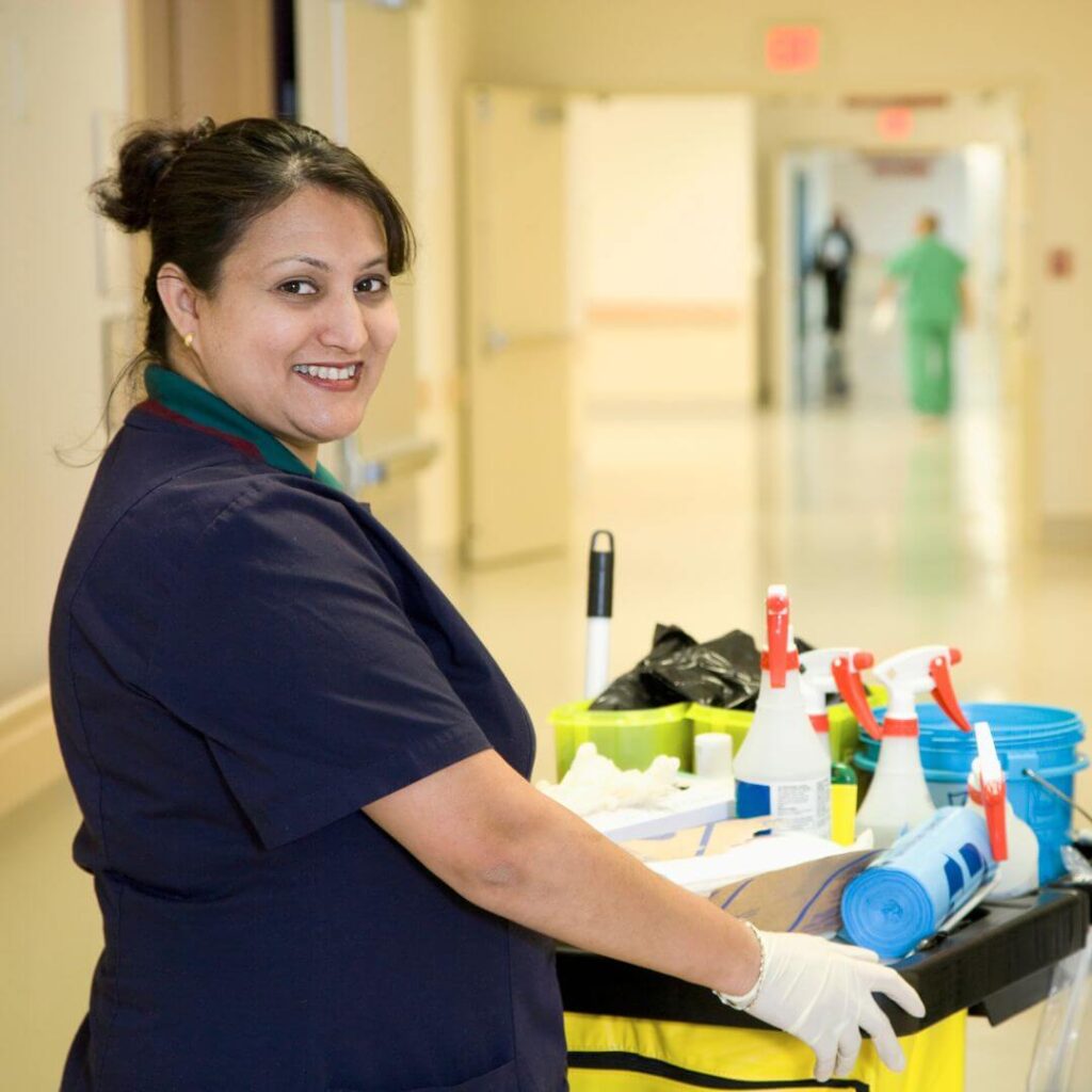 Smiling janitor in a medical office