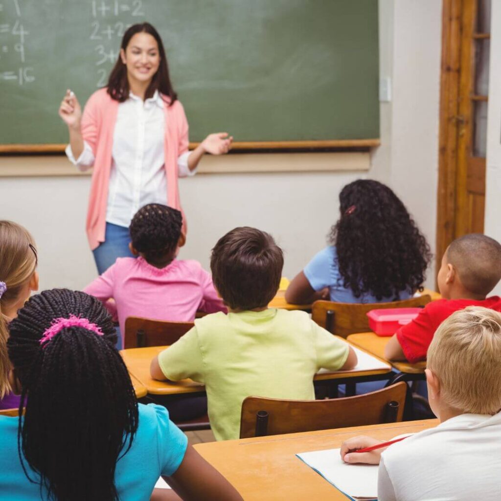 students and teacher in a classroom