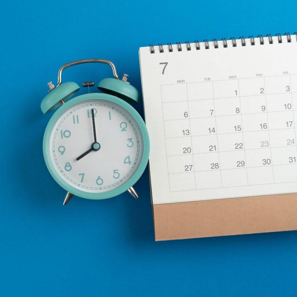 A calendar next to a clock